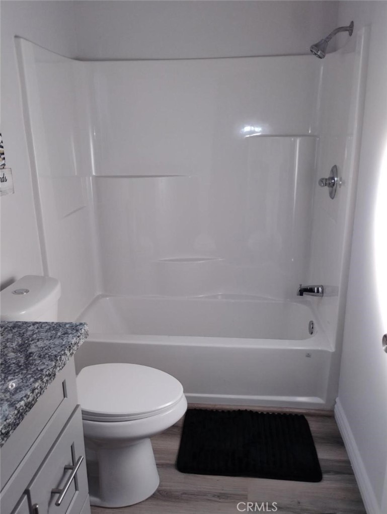 1901 North Grape Compton, CA 90222 - Photo 4 of 5 a bathroom with a toilet a sink and bathtub