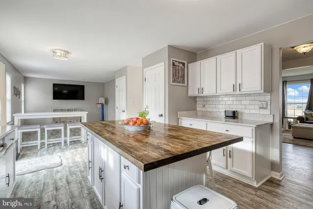 a kitchen with a stove a sink and a refrigerator