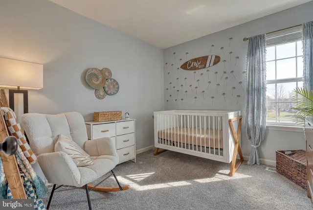 a bedroom with a bed and a table in it