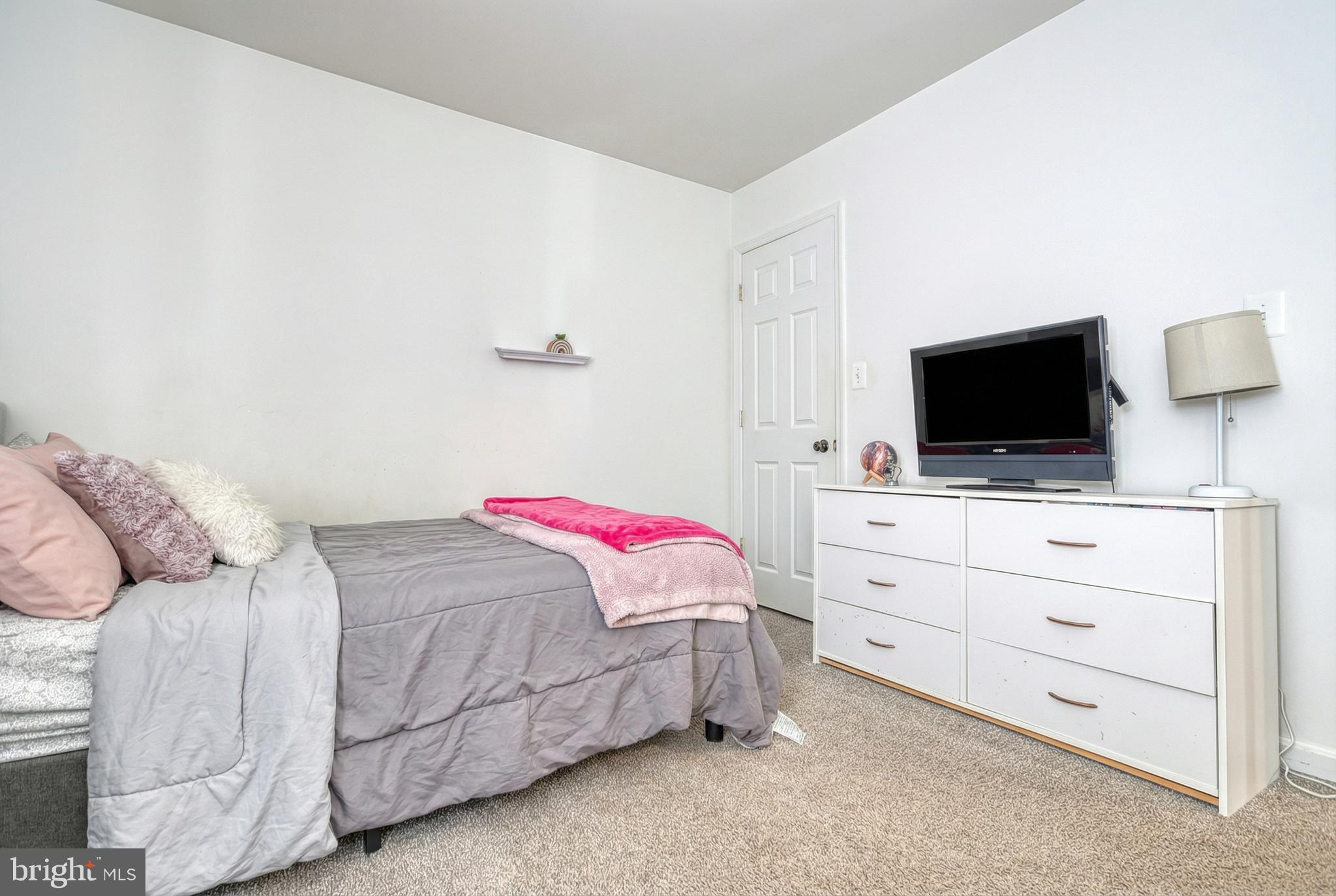 112 Farm Ln Circle York, PA 17408 - Photo 36 of 49 a bedroom with a bed and a flat screen tv