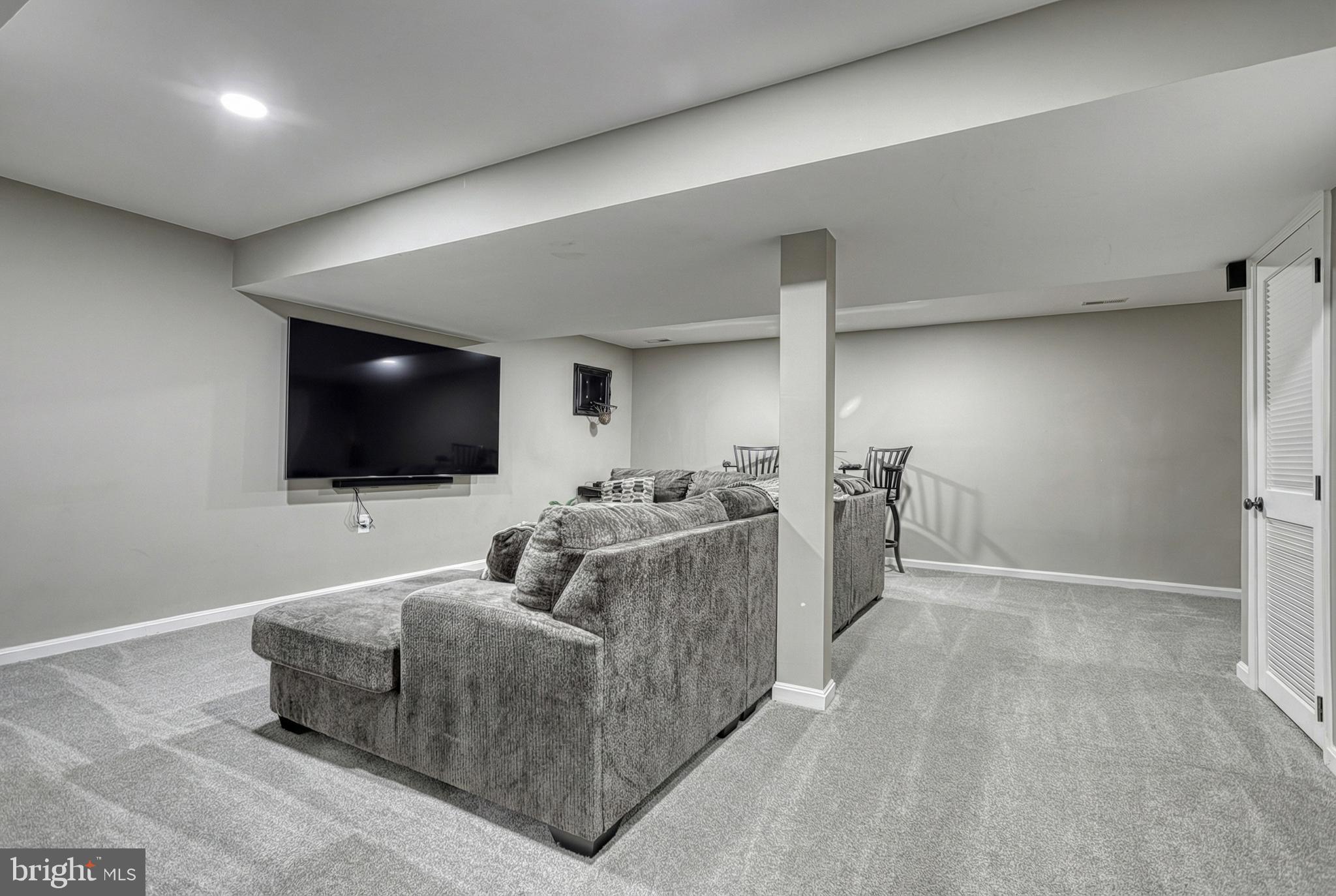 112 Farm Ln Circle York, PA 17408 - Photo 38 of 49 a living room with furniture and a flat screen tv
