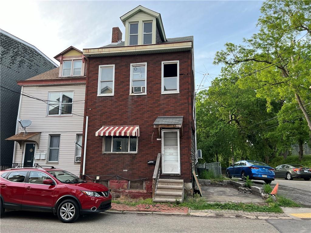 1150 Goettmann Street Pittsburgh, PA 15212 - Photo 1 of 49 a front view of a house with garden