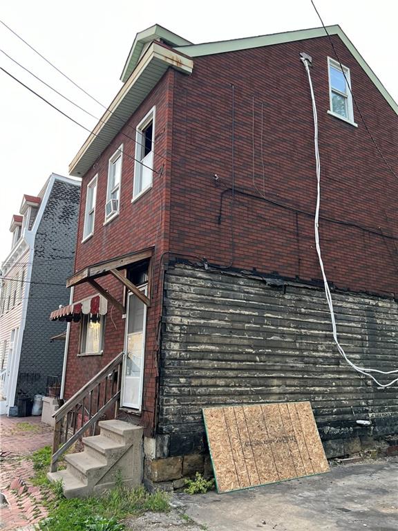 1150 Goettmann Street Pittsburgh, PA 15212 - Photo 3 of 49 a brick building with a small yard