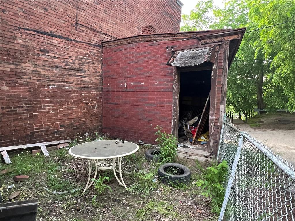 1150 Goettmann Street Pittsburgh, PA 15212 - Photo 6 of 49 a view of a chair and table in backyard