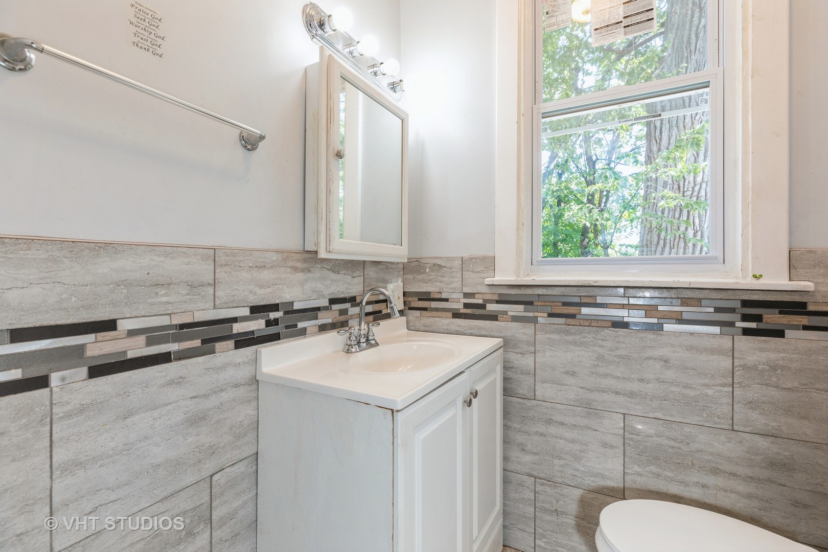 1024 West 87th Street Chicago, IL 60620 - Photo 9 of 10 a bathroom with a sink and a mirror