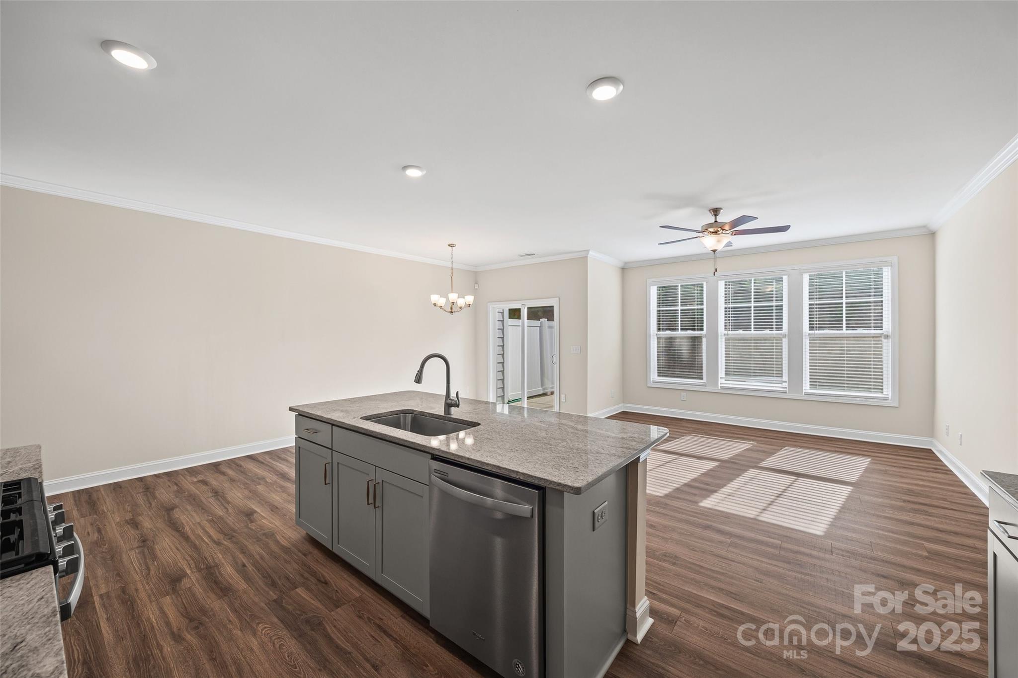 1018 Chicory Trace Clover, SC 29710 - Photo 6 of 37 a kitchen with a sink and wooden floor