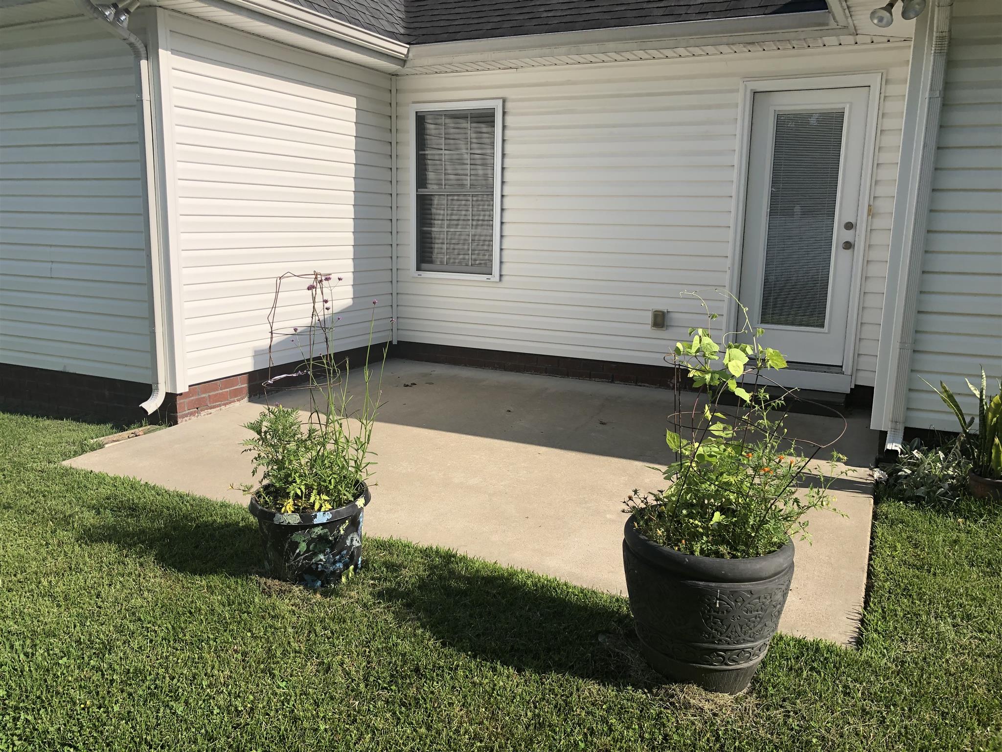 105 Foxrun Springfield, TN 37172 - Photo 5 of 21 a front view of a house with a yard
