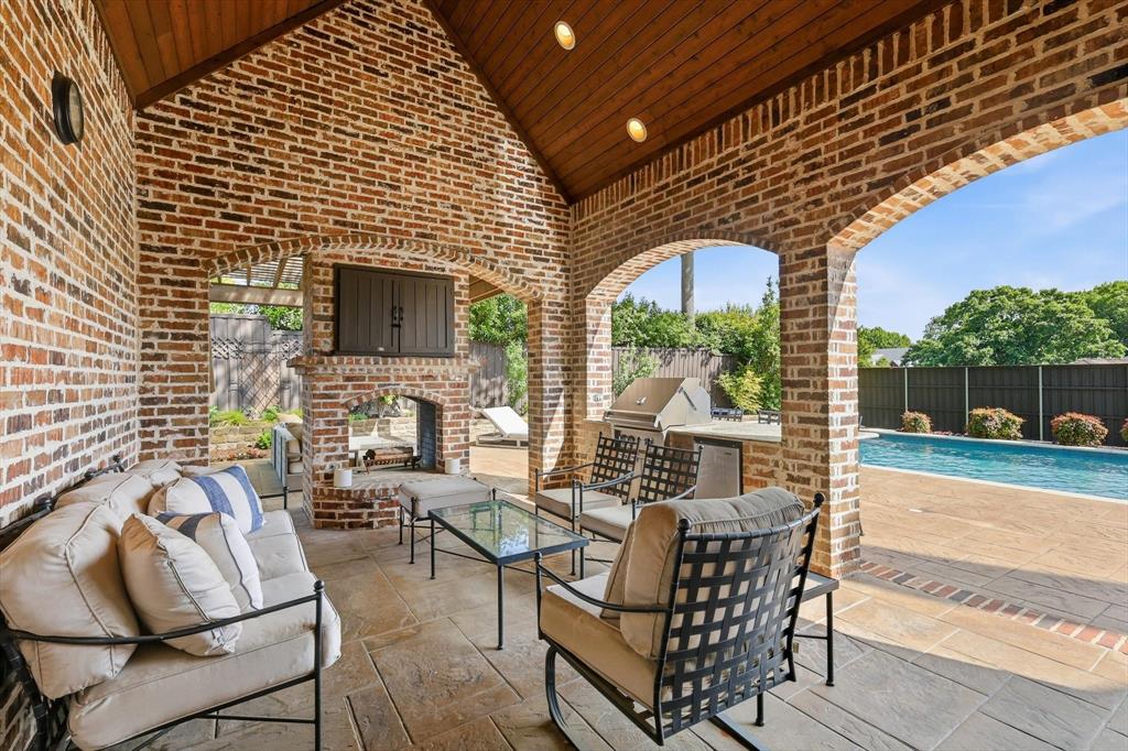 476 Hidden Valley Lane Coppell, TX 75019 - Photo 36 of 40 a patio with table and chairs
