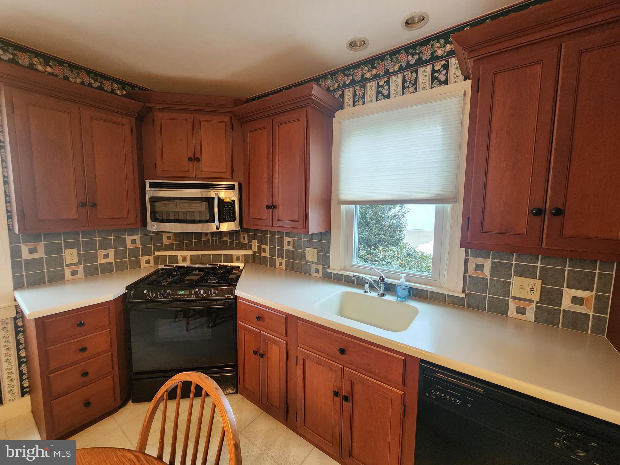 123 North 11th Street Akron, PA 17501 - Photo 15 of 43 a kitchen with stainless steel appliances a sink stove and cabinets