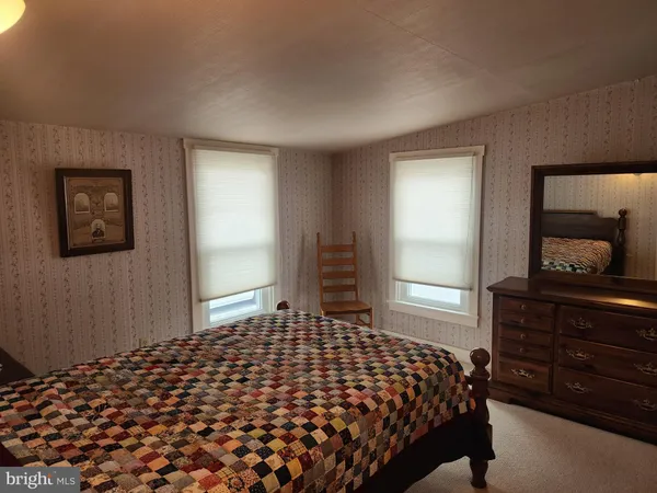 a bedroom with a bed and a walk in closet