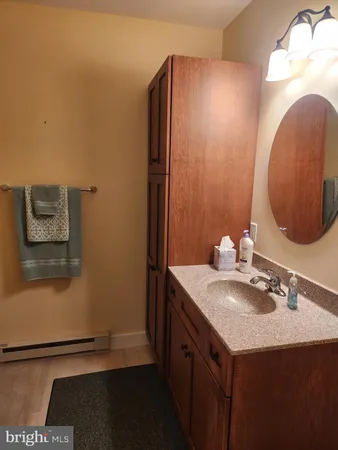 a bathroom with a glass door shower and toilet
