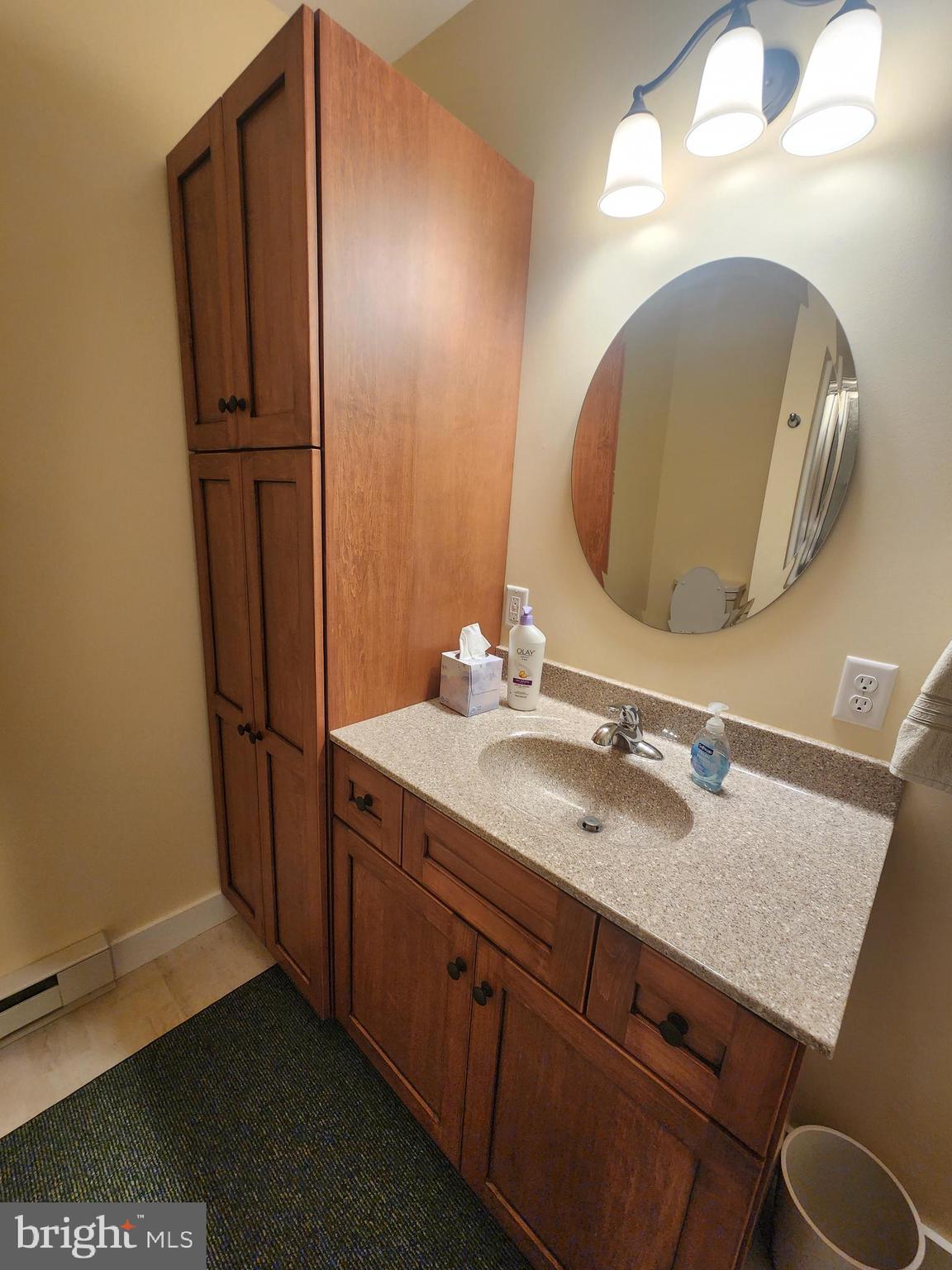 123 North 11th Street Akron, PA 17501 - Photo 41 of 43 a bathroom with a granite countertop sink and a mirror