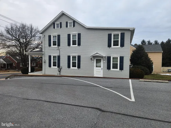 a big house with a street