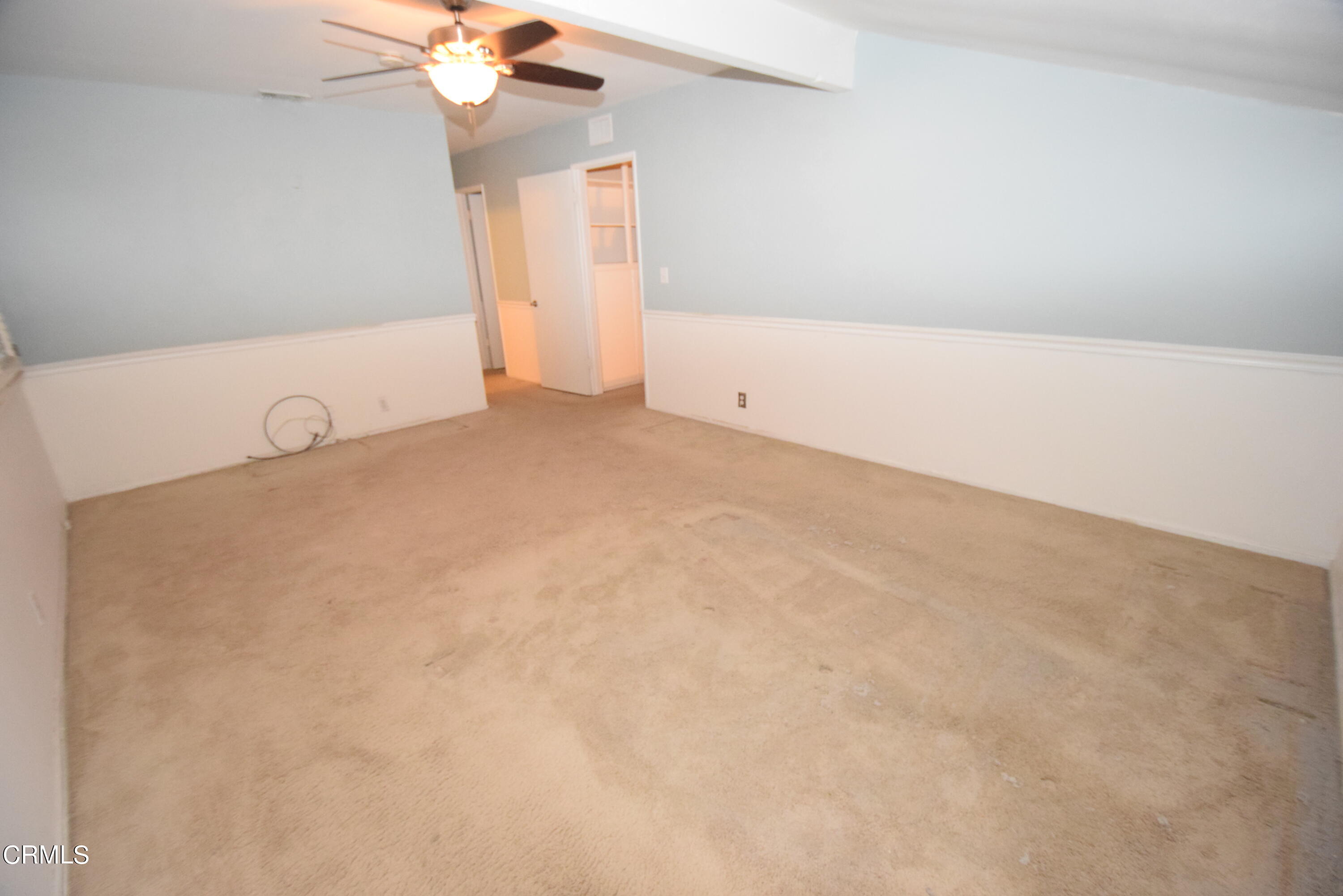 166 Ripley Street Camarillo, CA 93010 - Photo 16 of 28 a view of a room with a ceiling fan and closet