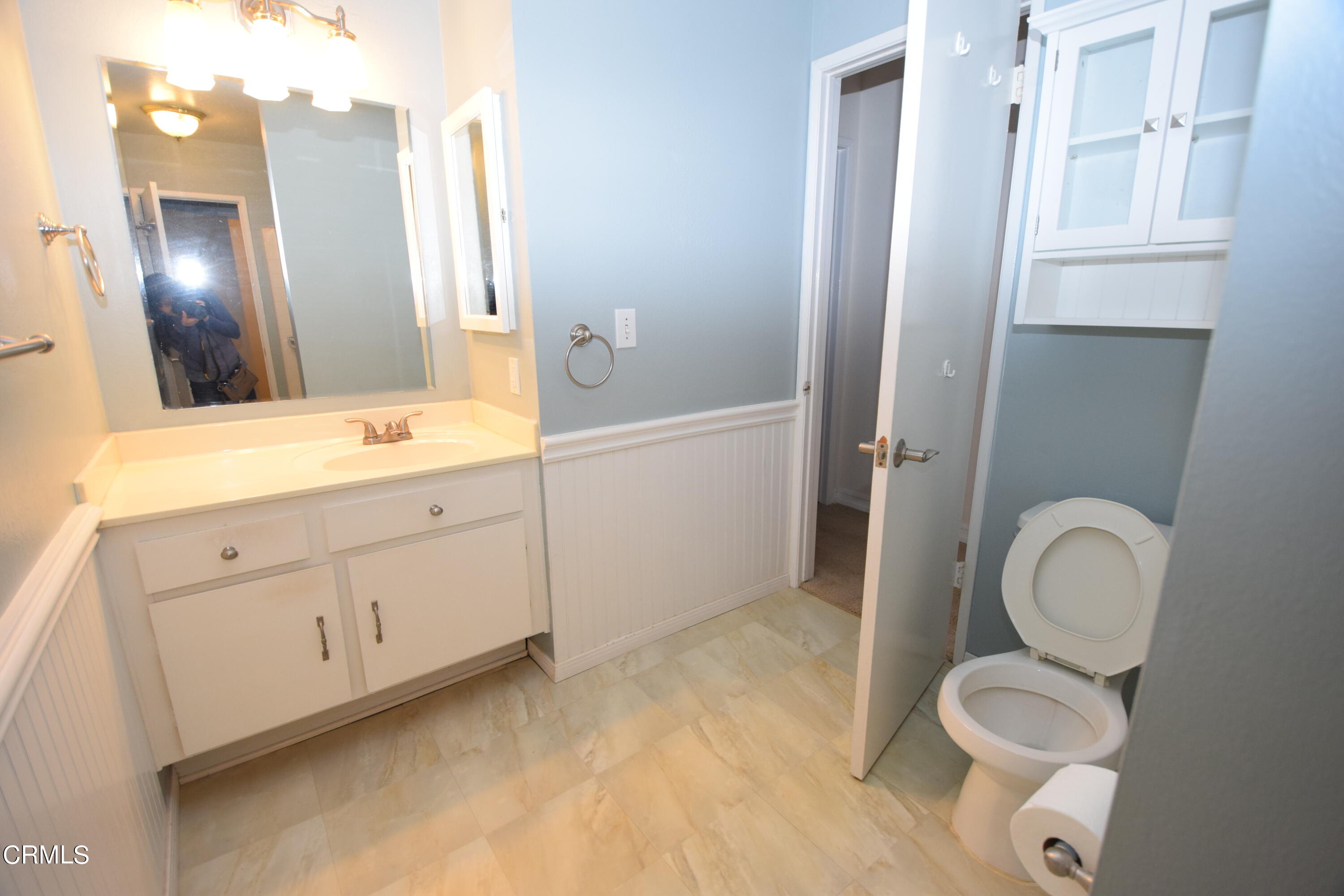 166 Ripley Street Camarillo, CA 93010 - Photo 20 of 28 a spacious bathroom with a toilet a sink and a mirror