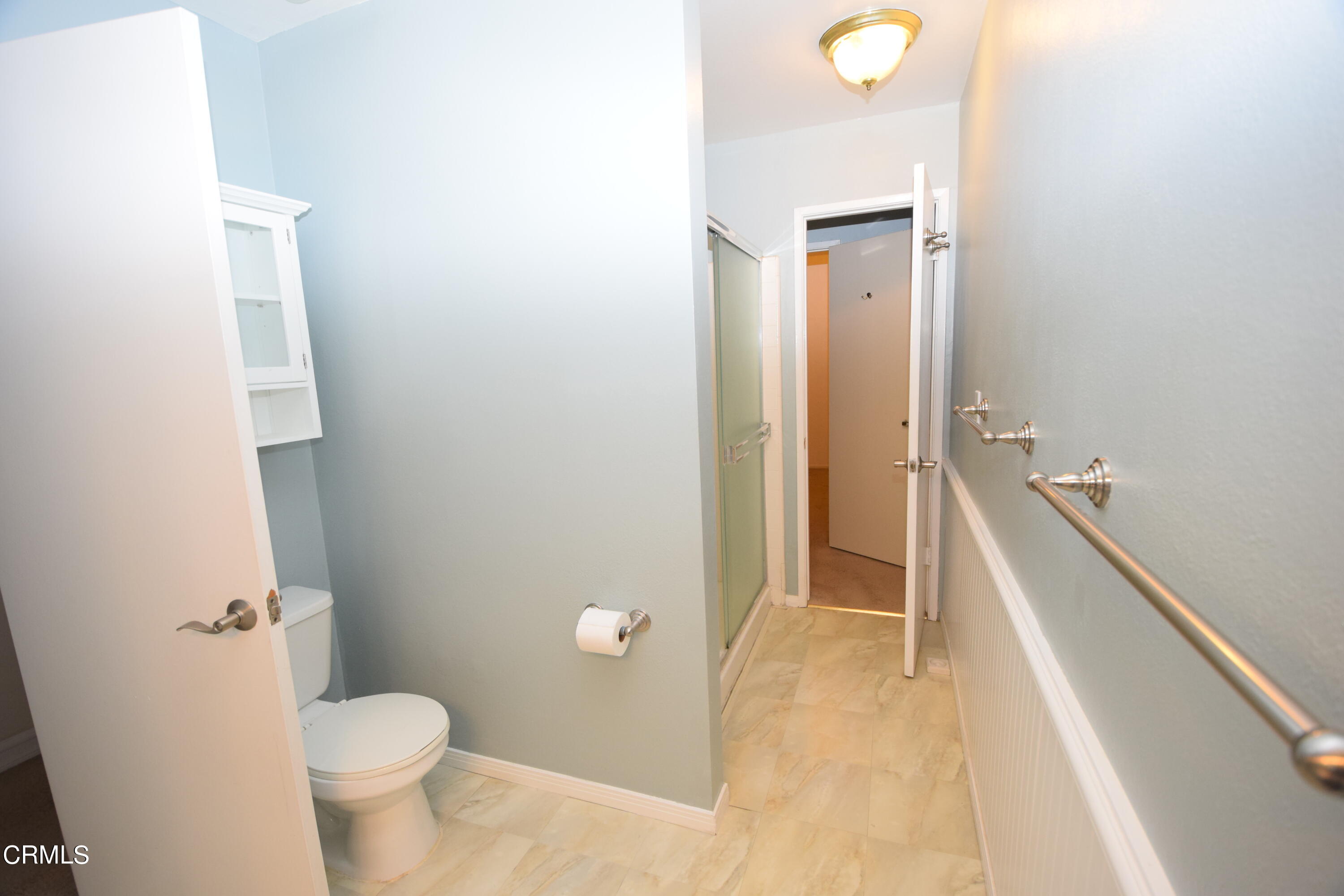 166 Ripley Street Camarillo, CA 93010 - Photo 21 of 28 a bathroom with a granite countertop sink and a toilet
