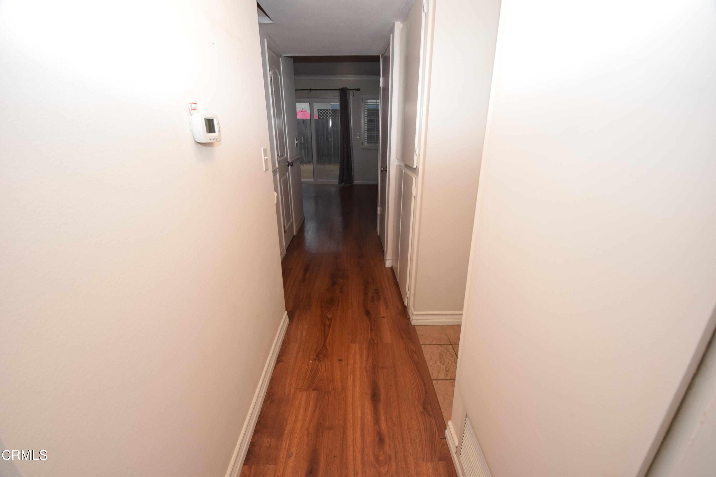 166 Ripley Street Camarillo, CA 93010 - Photo 6 of 28 a view of a hallway with wooden floor