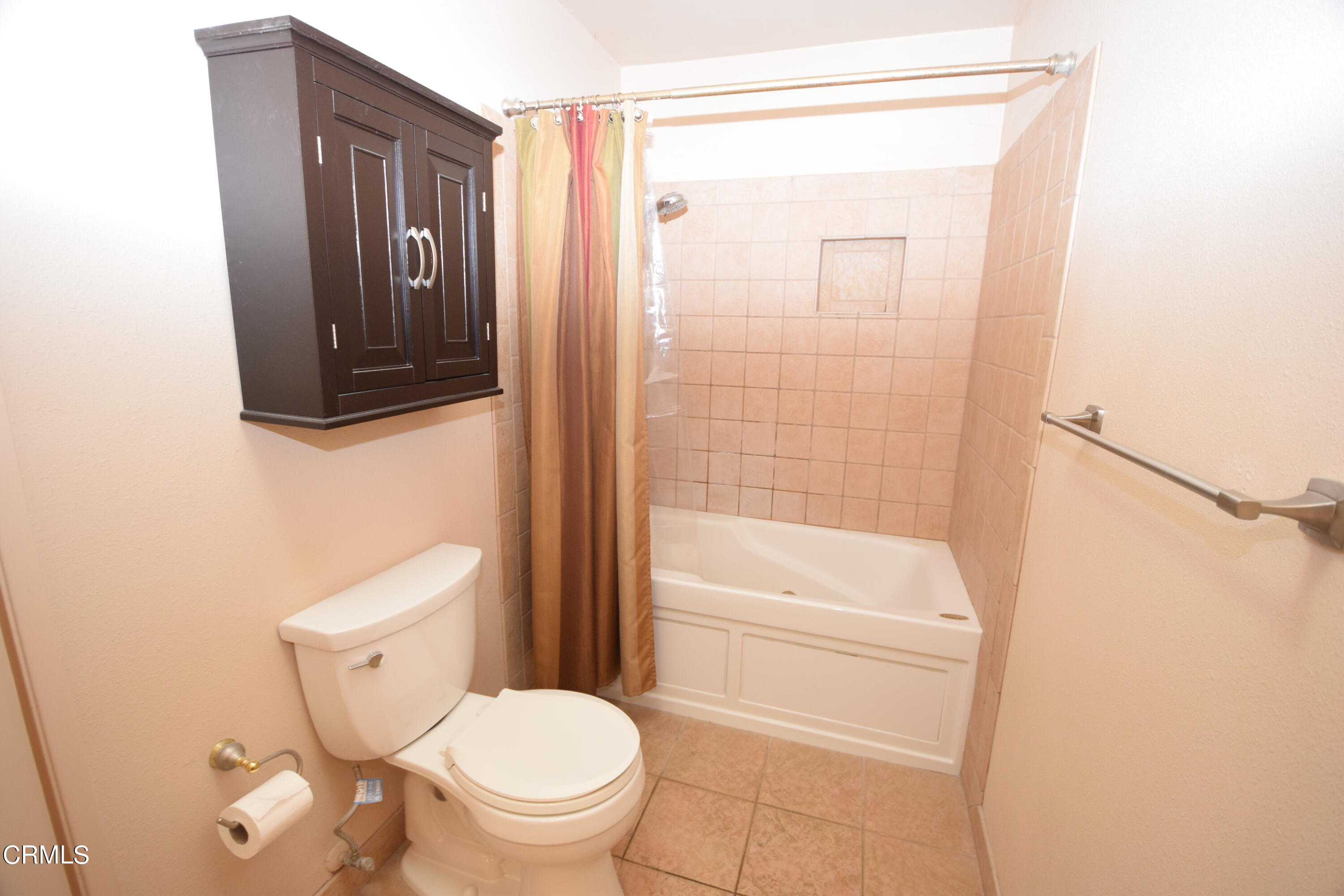 166 Ripley Street Camarillo, CA 93010 - Photo 7 of 28 a bathroom with a toilet a sink a mirror and shower