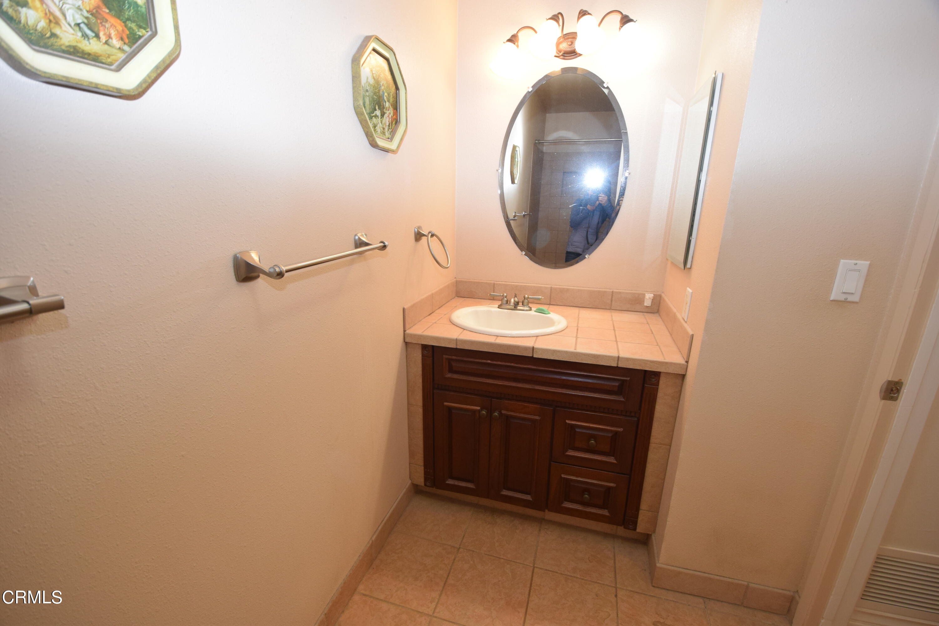 166 Ripley Street Camarillo, CA 93010 - Photo 8 of 28 a bathroom with a sink and a mirror