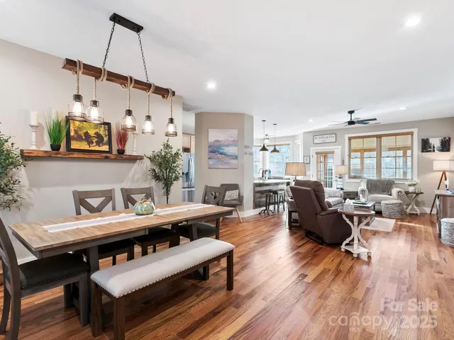 a bathroom with a granite countertop sink a mirror and a shower