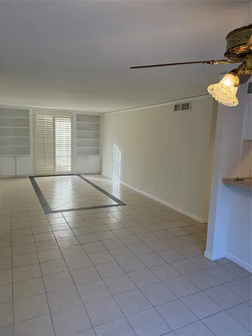 a kitchen with a sink a stove and a refrigerator