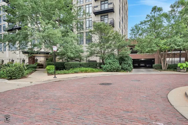 a bathroom with a glass door shower and a sink