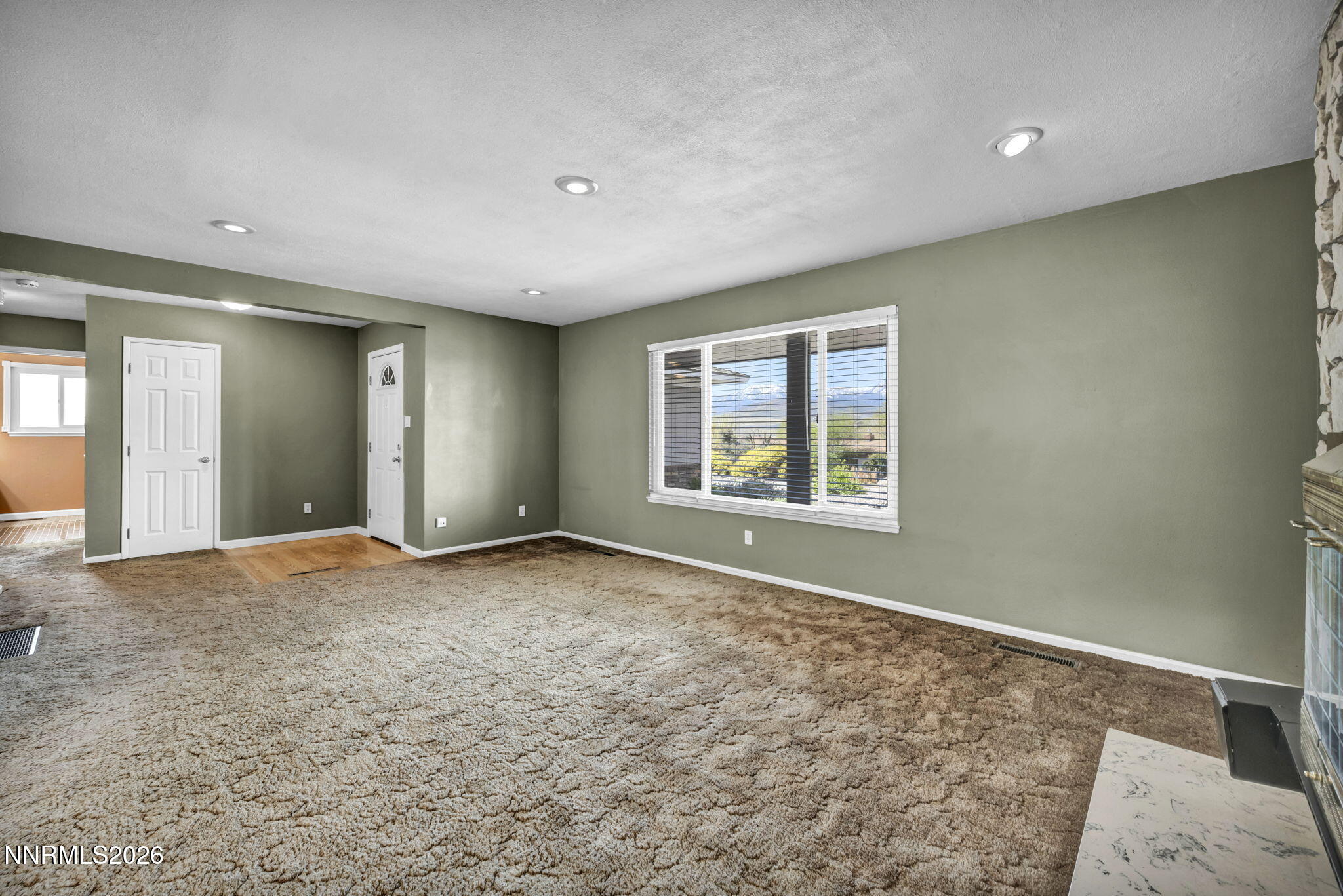 14190 Rim Rock Drive Reno, NV 89521 - Photo 7 of 68 an empty room with windows