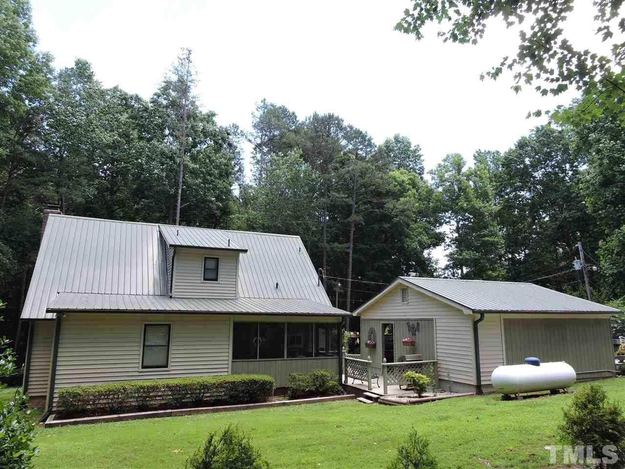669 Ivey Day Road Roxboro, NC 27574 - Photo 14 of 24 a front view of a house with garden