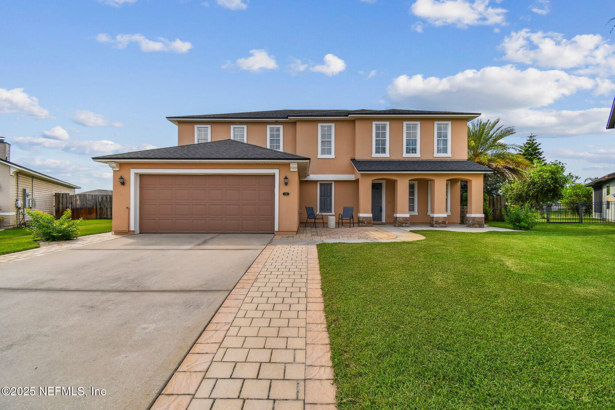 116 Nunna Rock Trail St. Augustine, FL 32092 - Photo 1 of 111 a front view of a house with garden