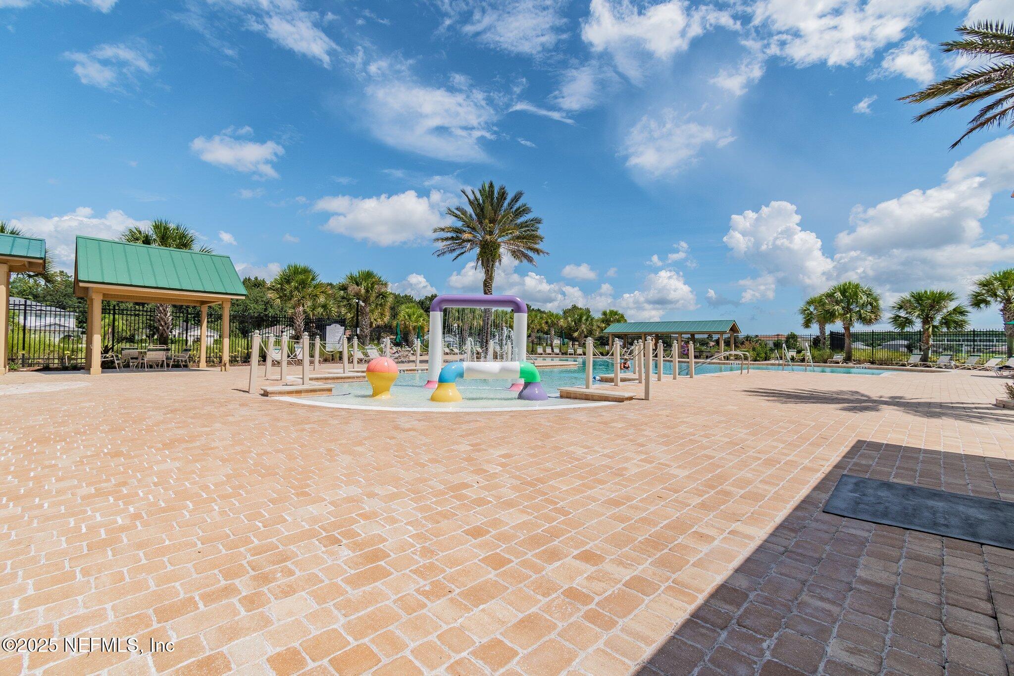 116 Nunna Rock Trail St. Augustine, FL 32092 - Photo 101 of 111 a view of swimming pool with outdoor seating and a pathway