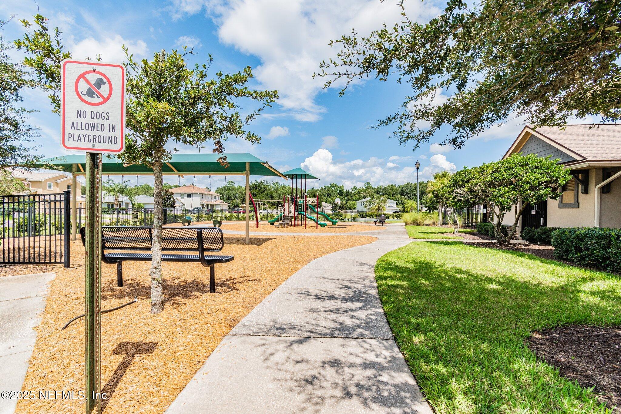116 Nunna Rock Trail St. Augustine, FL 32092 - Photo 105 of 111 a swimming pool with outdoor seating and yard