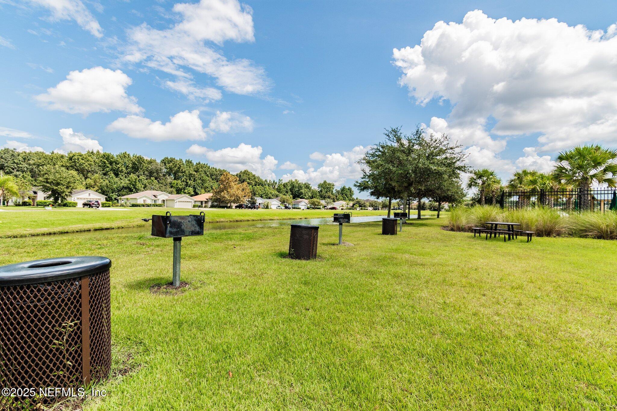 116 Nunna Rock Trail St. Augustine, FL 32092 - Photo 110 of 111 a view of a lake with a garden