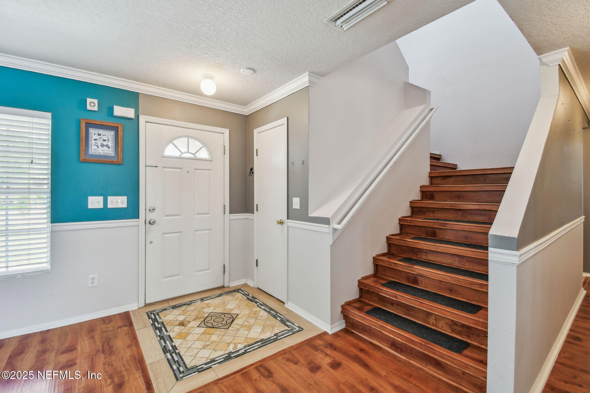 116 Nunna Rock Trail St. Augustine, FL 32092 - Photo 26 of 111 a view of entryway with stairs and wooden floor