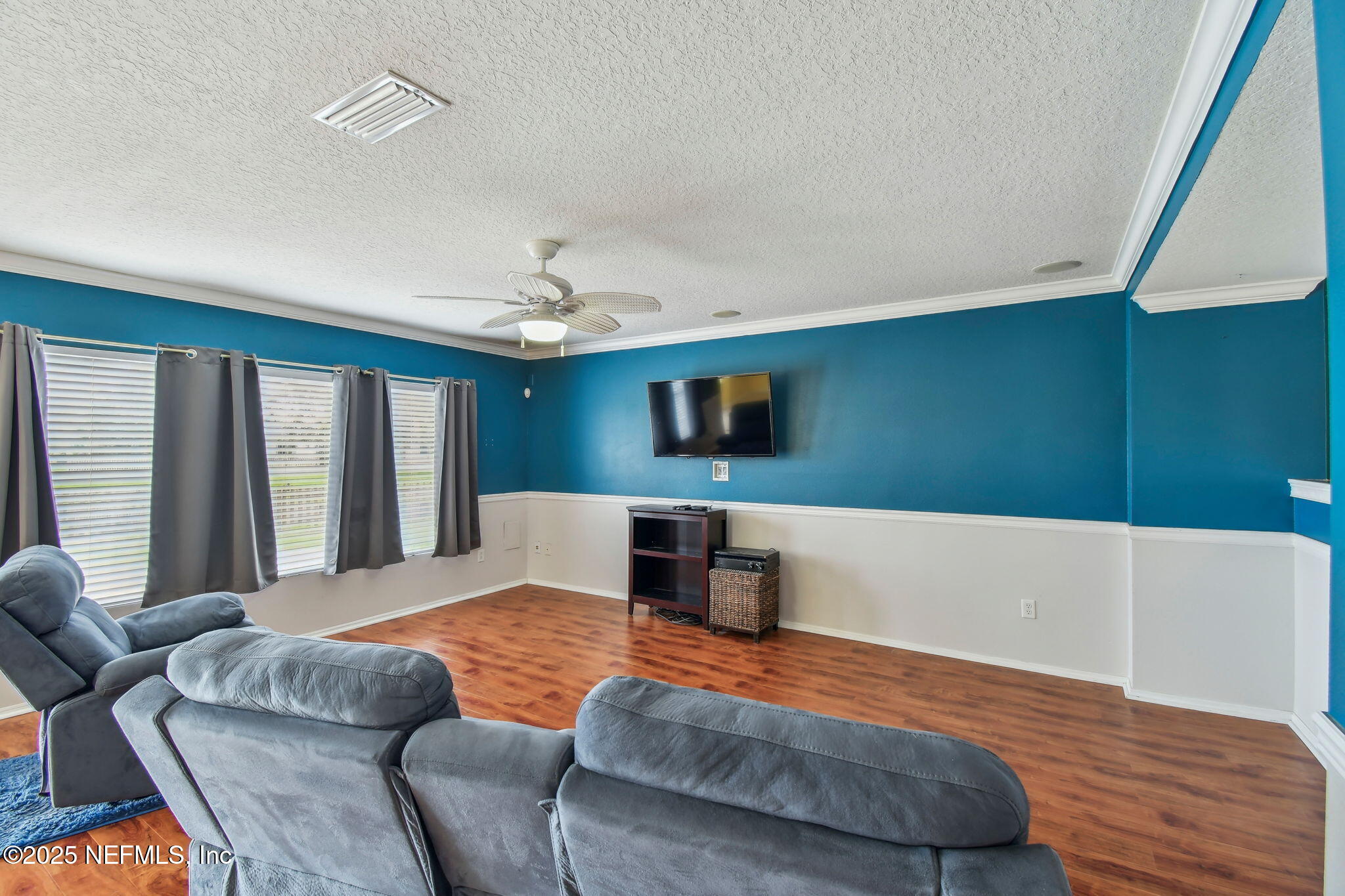 116 Nunna Rock Trail St. Augustine, FL 32092 - Photo 30 of 111 a bedroom with a large bed and a flat screen tv