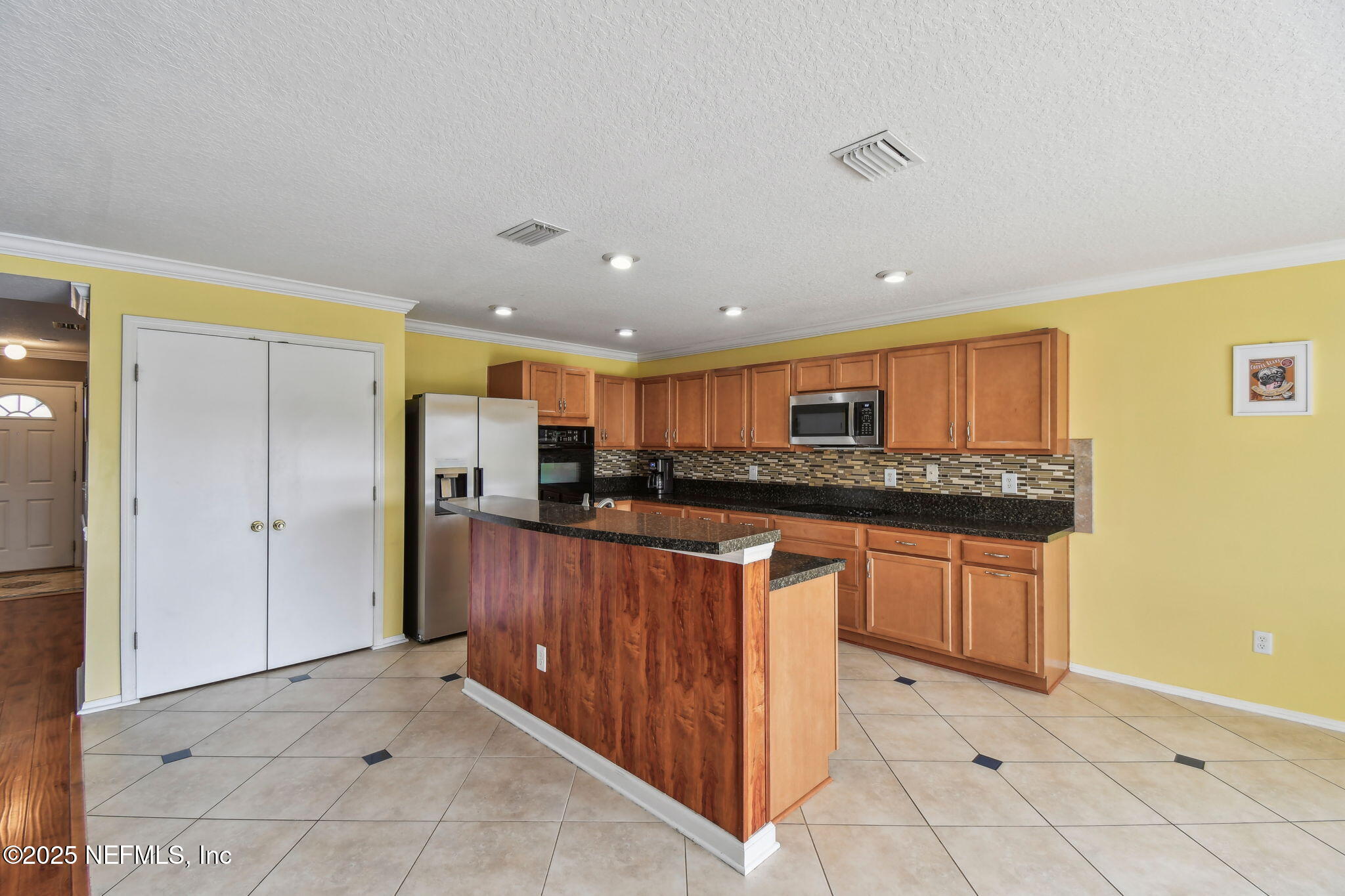 116 Nunna Rock Trail St. Augustine, FL 32092 - Photo 36 of 111 a kitchen with stainless steel appliances granite countertop a refrigerator and a stove top oven