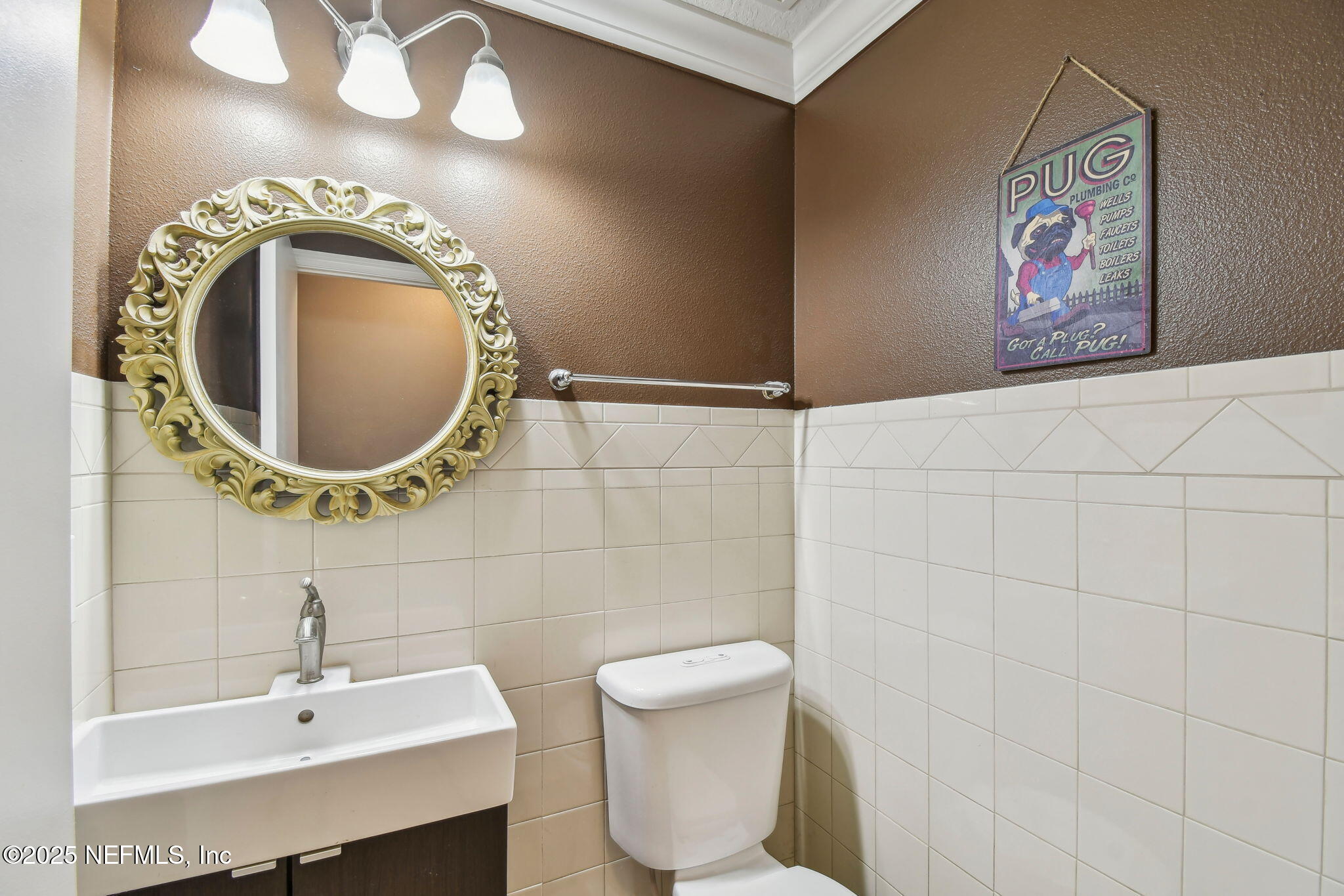 116 Nunna Rock Trail St. Augustine, FL 32092 - Photo 45 of 111 a bathroom with a toilet sink and mirror