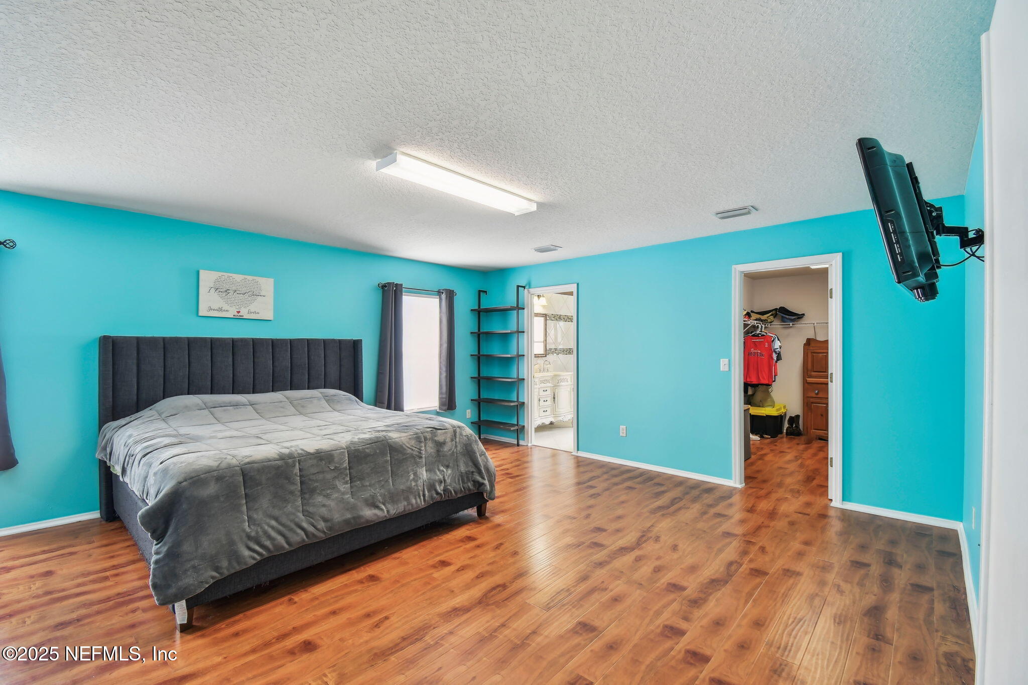 116 Nunna Rock Trail St. Augustine, FL 32092 - Photo 46 of 111 a bedroom with a bed and painting on the wall