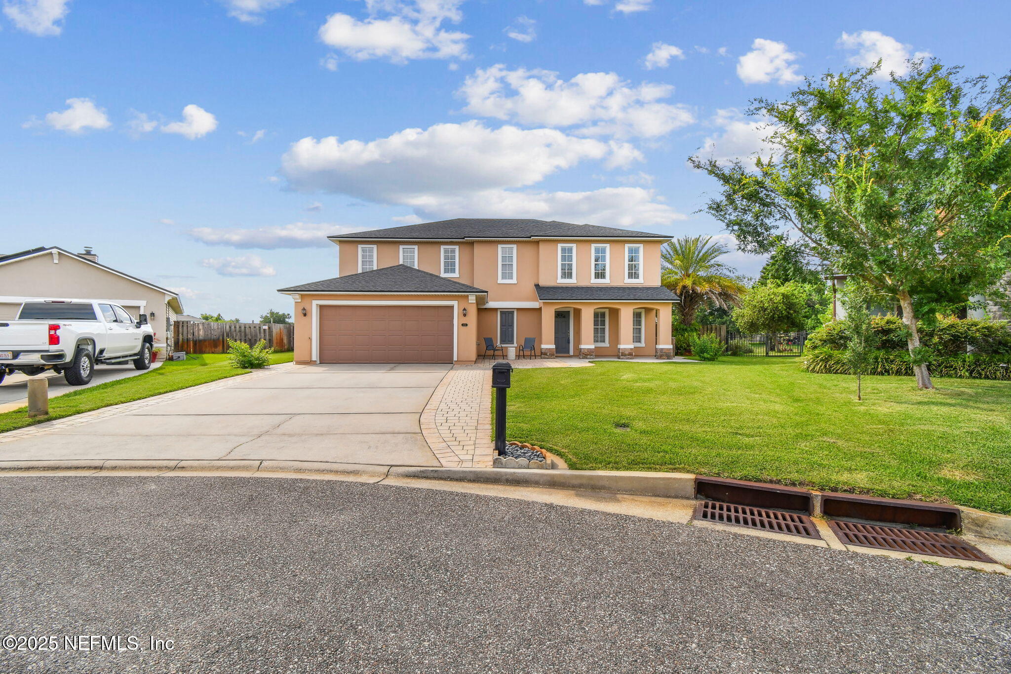 116 Nunna Rock Trail St. Augustine, FL 32092 - Photo 5 of 111 a front view of a house with a yard and garage