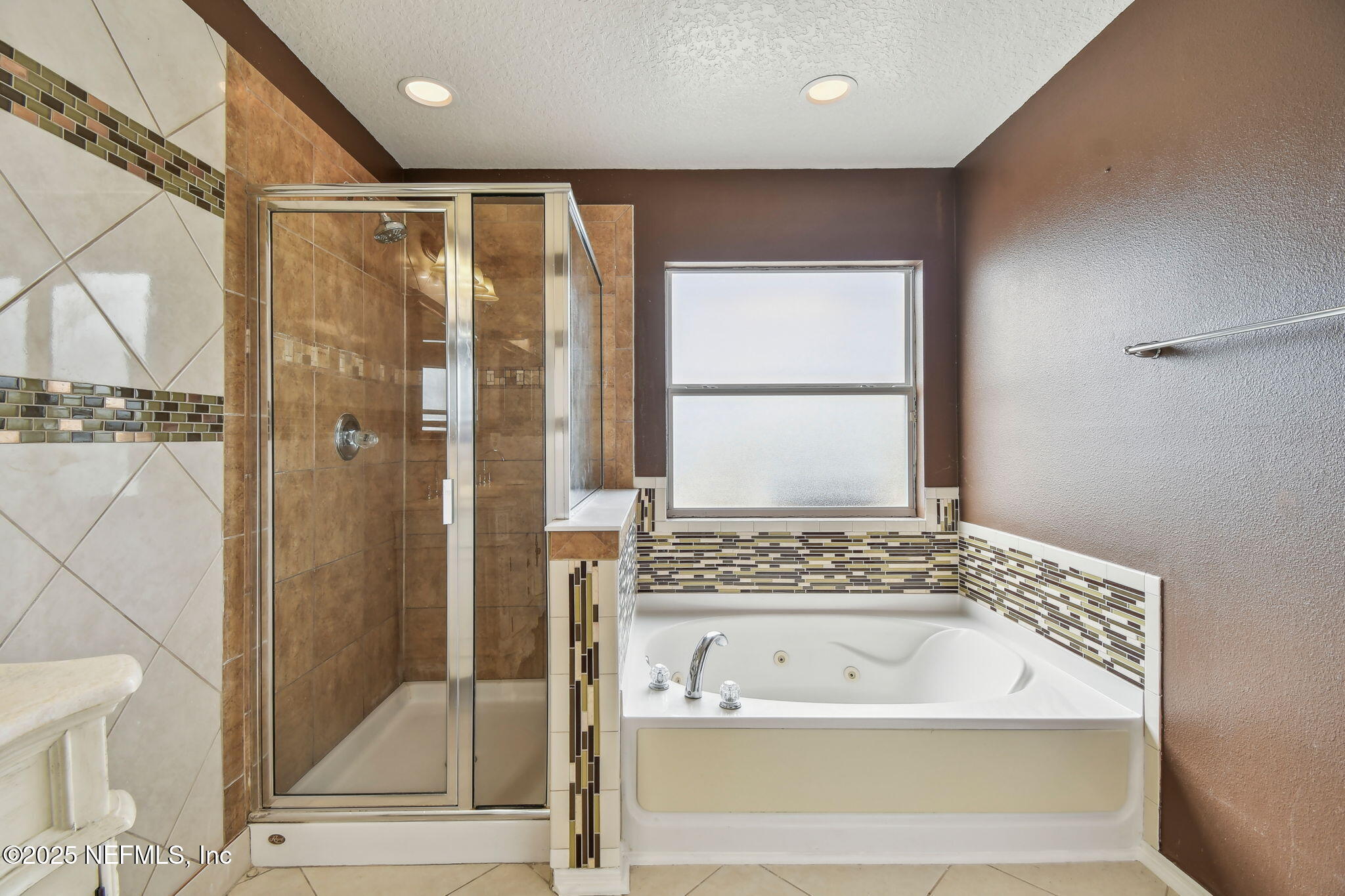 116 Nunna Rock Trail St. Augustine, FL 32092 - Photo 52 of 111 a bathroom with a bathtub and a shower