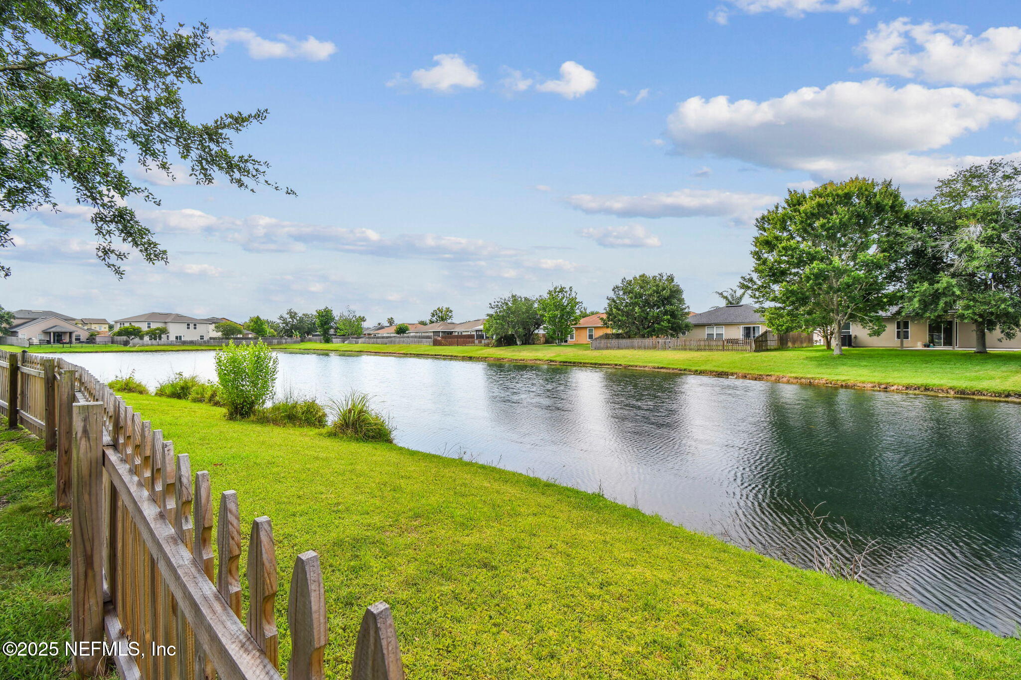 116 Nunna Rock Trail St. Augustine, FL 32092 - Photo 62 of 111 a view of a lake with houses in the back