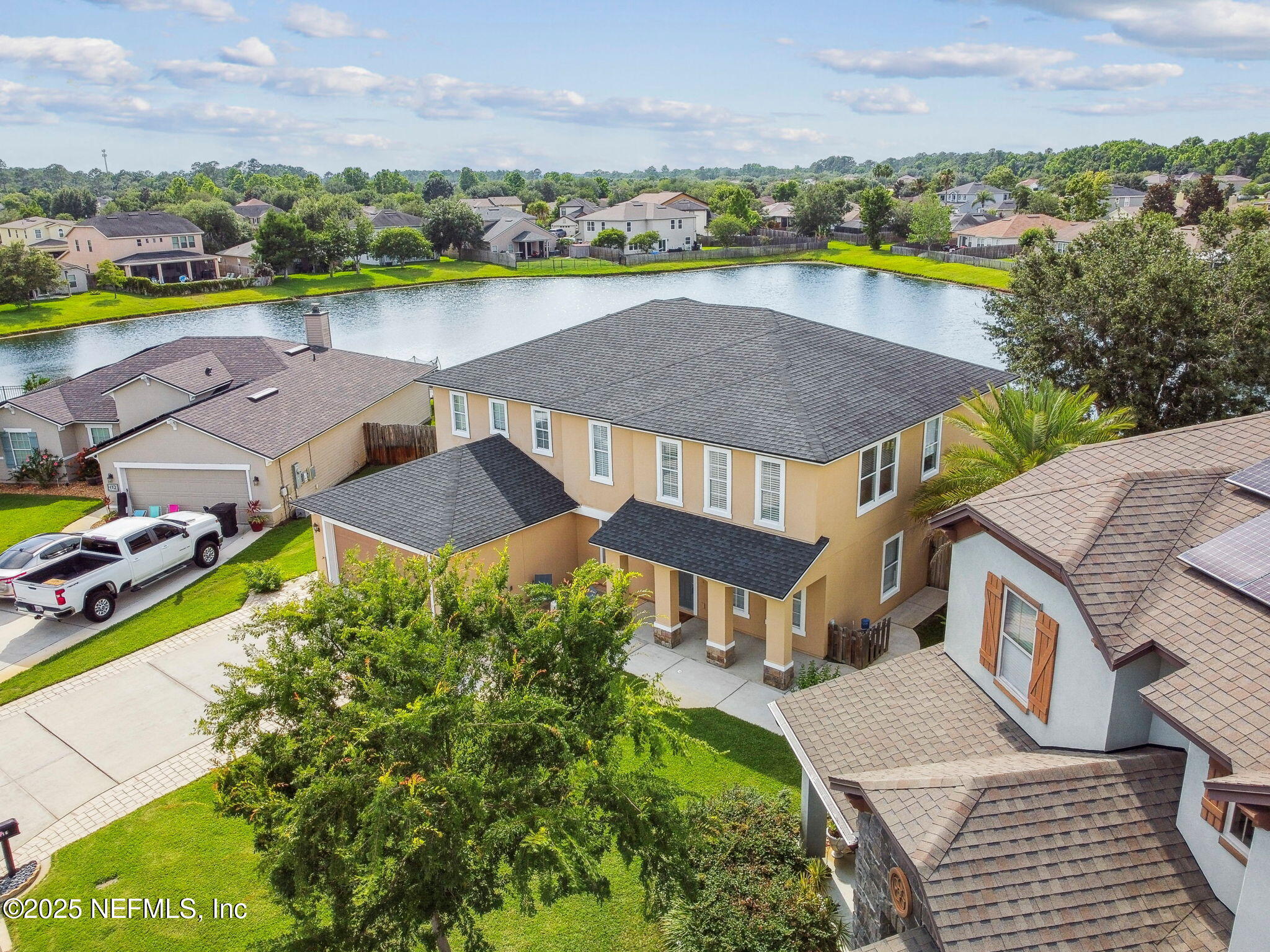 116 Nunna Rock Trail St. Augustine, FL 32092 - Photo 67 of 111 an aerial view of a house with a garden and lake view