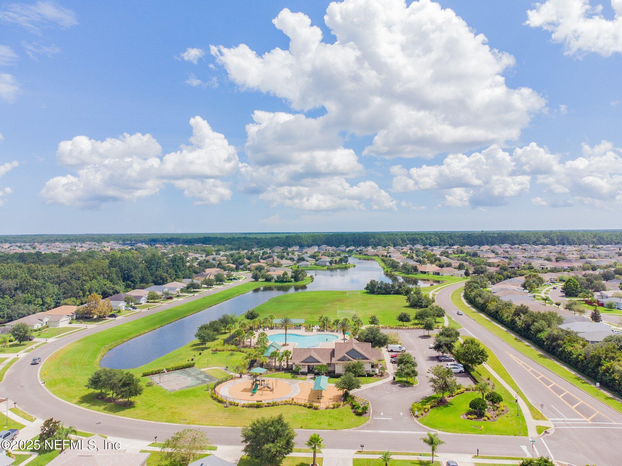 116 Nunna Rock Trail St. Augustine, FL 32092 - Photo 88 of 111 a view of a swimming pool with a lot of trees in the background