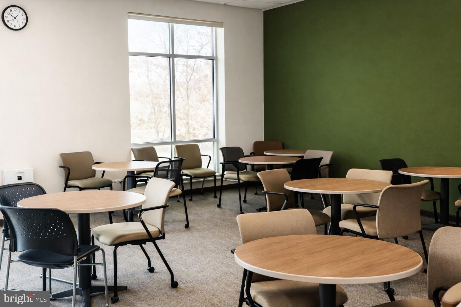 14216 Alderton Road Silver Spring, MD 20906 - Photo 11 of 14 a view of a dining room with furniture and a window