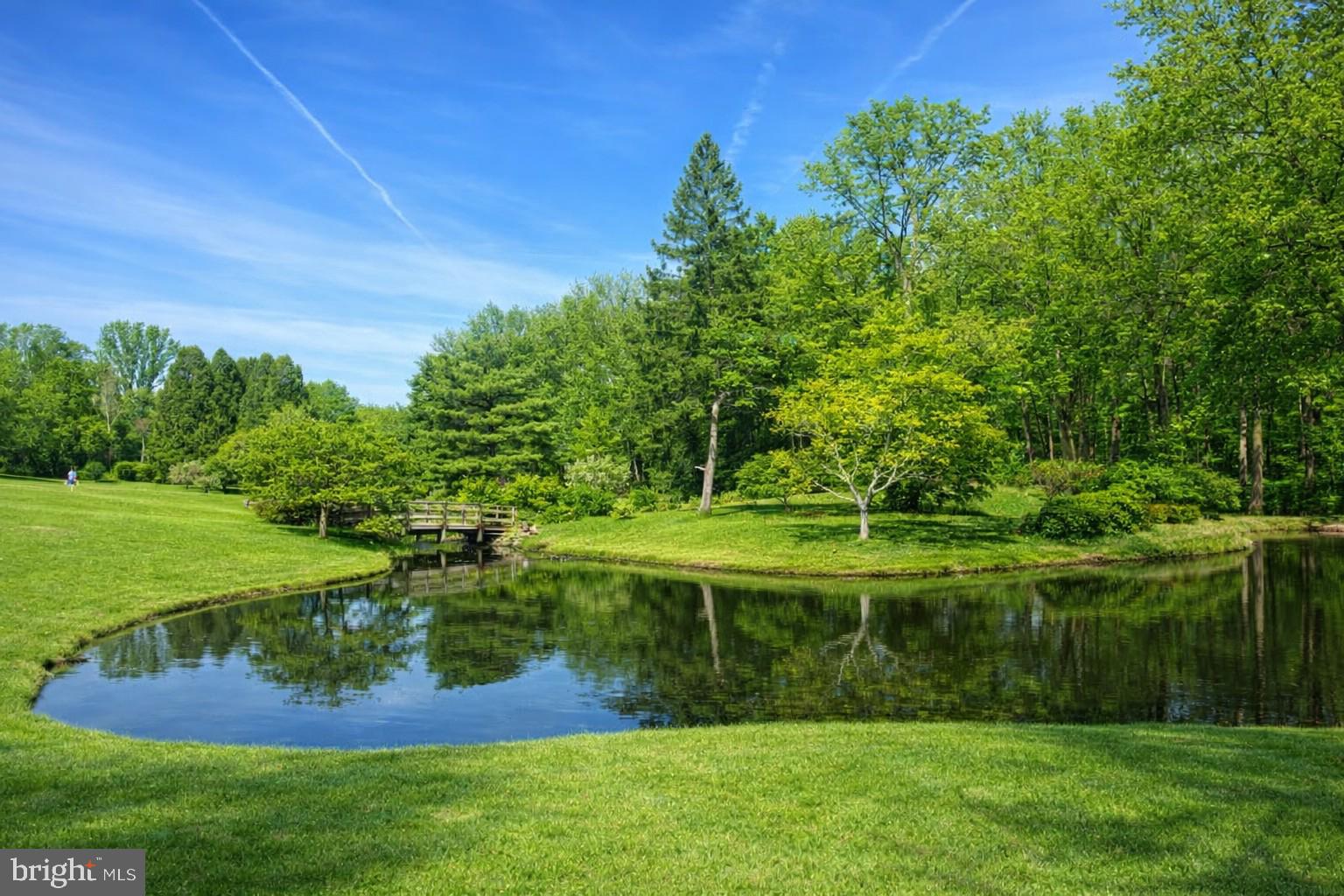 14216 Alderton Road Silver Spring, MD 20906 - Photo 13 of 14 a view of a golf course with a lake