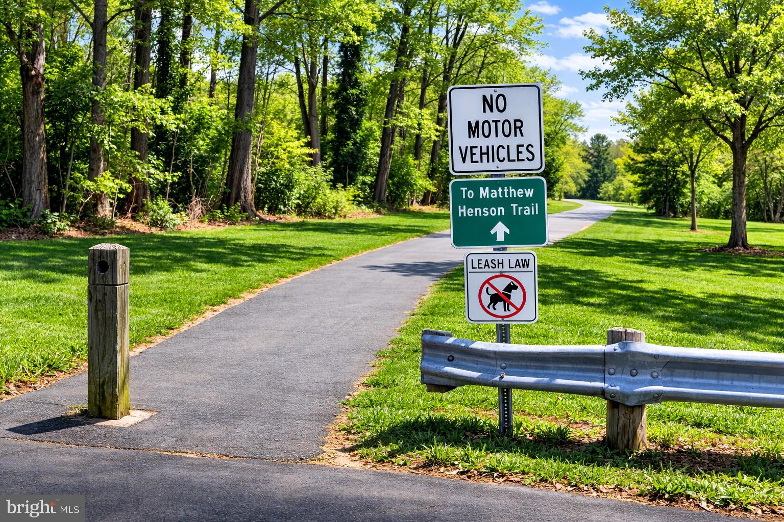 14216 Alderton Road Silver Spring, MD 20906 - Photo 7 of 14 a sign that is sitting on a park with some trees