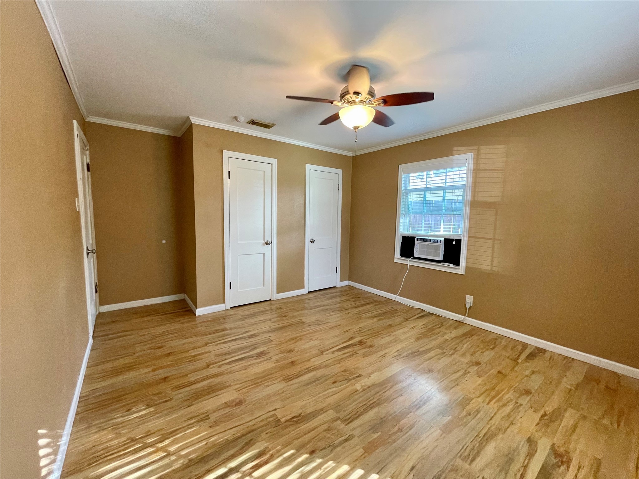 1113 Chevy Chase Drive Angleton, TX 77515 - Photo 16 of 32 a view of an empty room with a chandelier fan