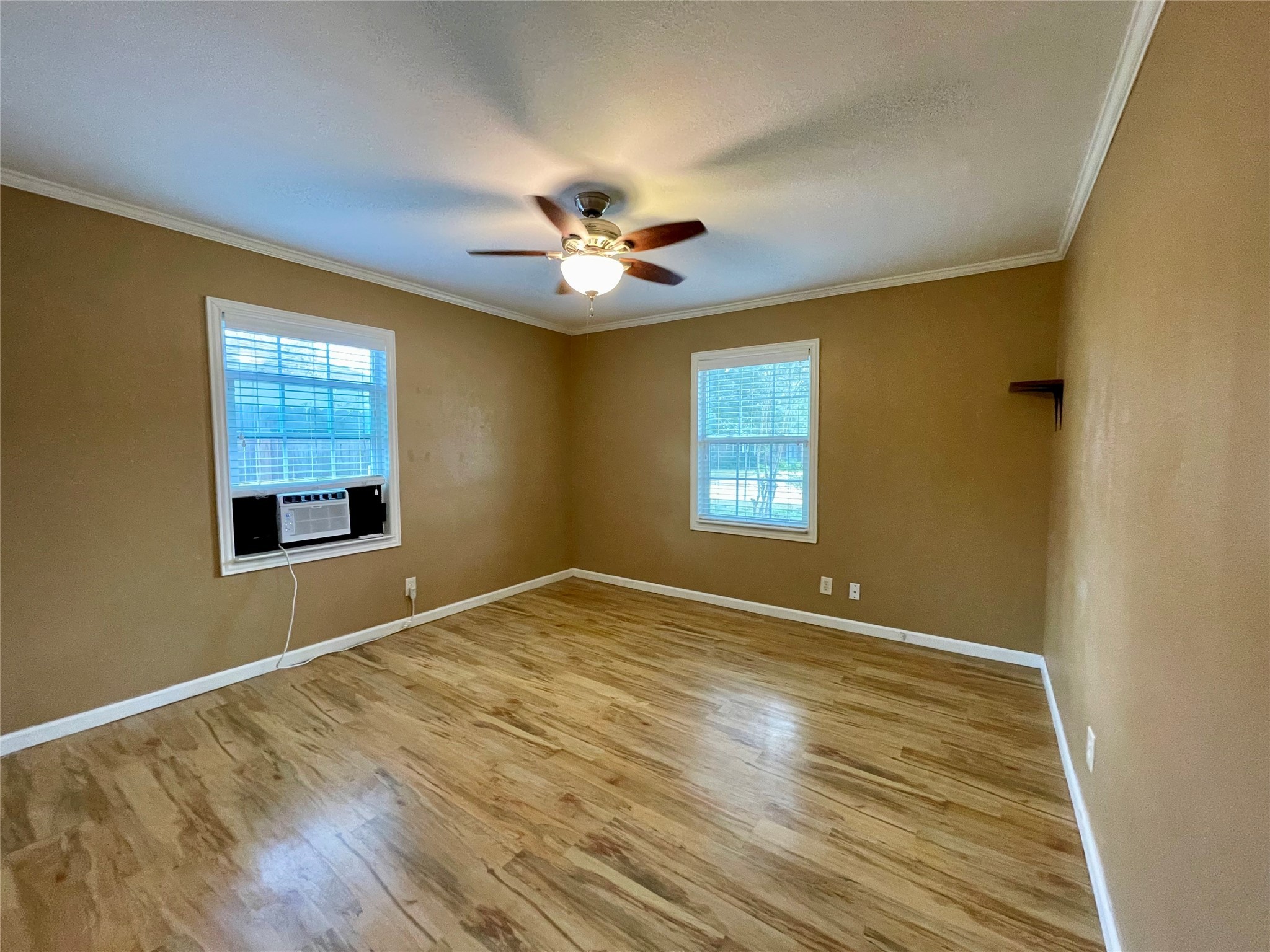 1113 Chevy Chase Drive Angleton, TX 77515 - Photo 17 of 32 a view of an empty room with a window