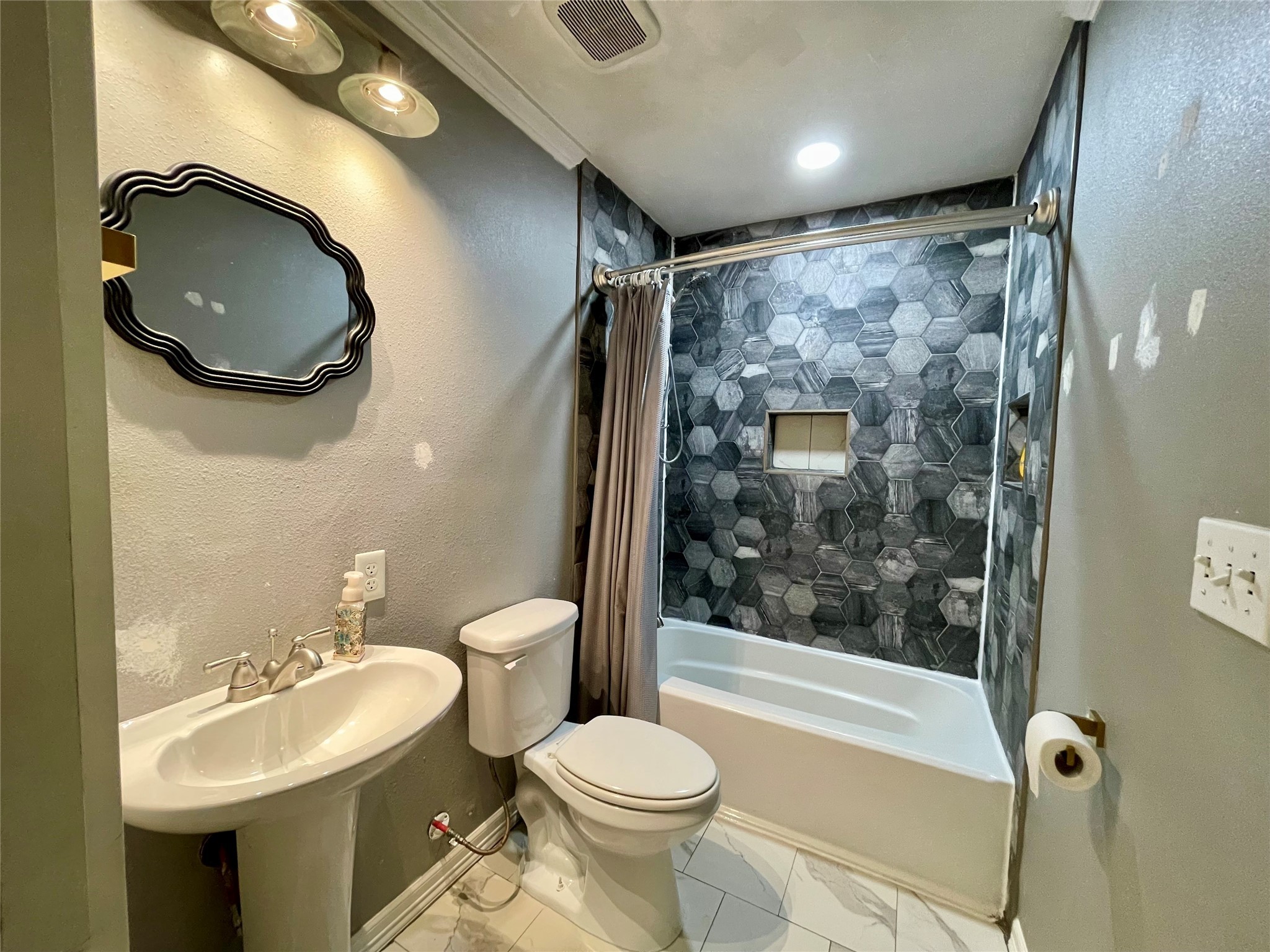 1113 Chevy Chase Drive Angleton, TX 77515 - Photo 22 of 32 a bathroom with a sink and a mirror