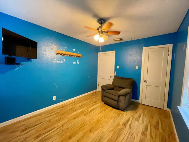 a bed room with a bed and a chandelier