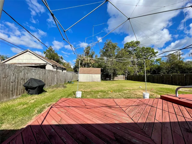 a swimming pool with trees in front of it